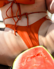 Outdoor porn pics of dazzling MILF posing naked with watermelon