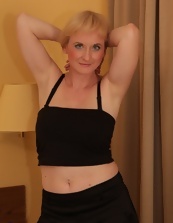 Beautiful milf sex models are posing in sexy skirts at mature porn photo session